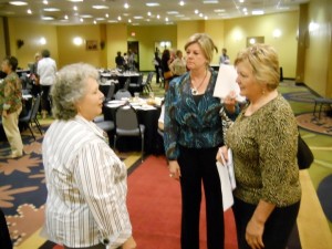 Patsy visiting with two of the Chamber of Commerce women