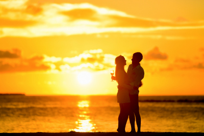 couple-on-beach-with-sunset-400x267